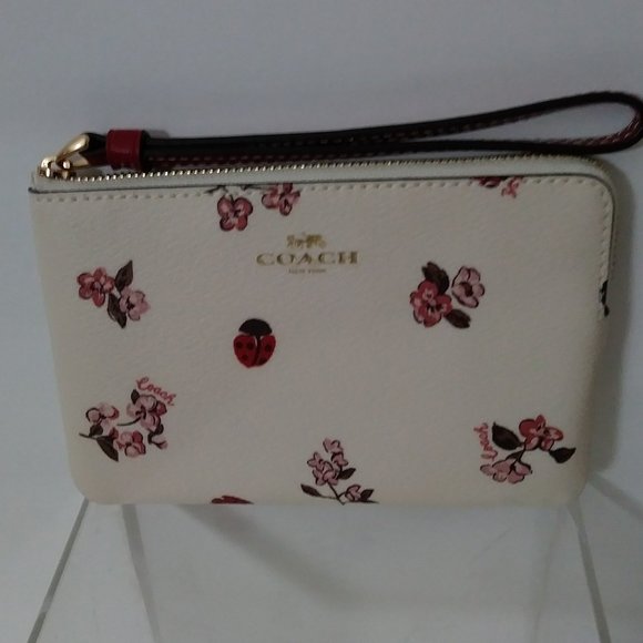 Coach Handbags - Coach Corner Zip Wristlet Chalk Multi with Floral Bow Print $78.00